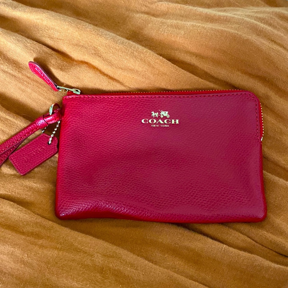 NWOT Red pebbled leather small Coach wristlet with strap and gold hardware.